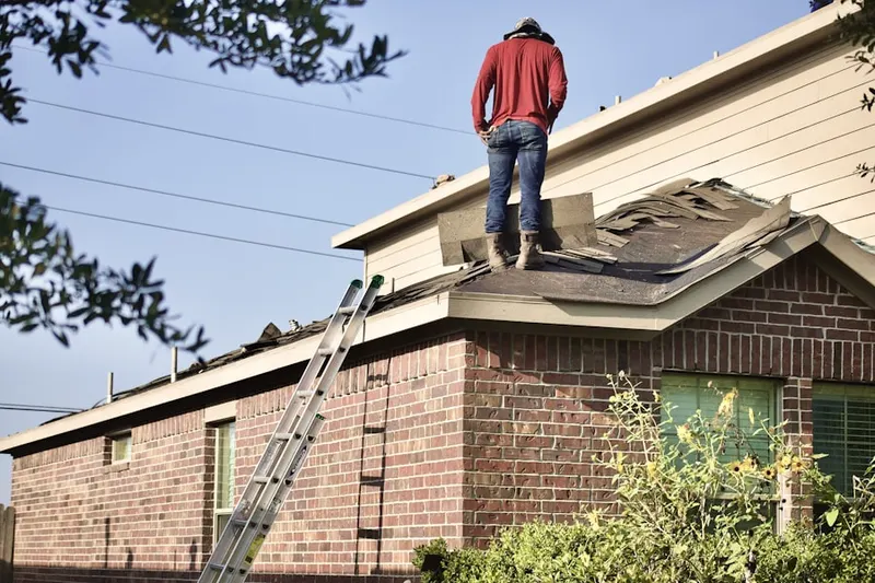 Professional roofer working on a residential roof in Encinitas
